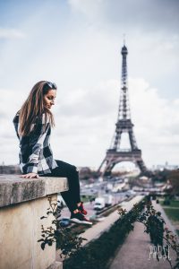 girl in front of the eiffel tower